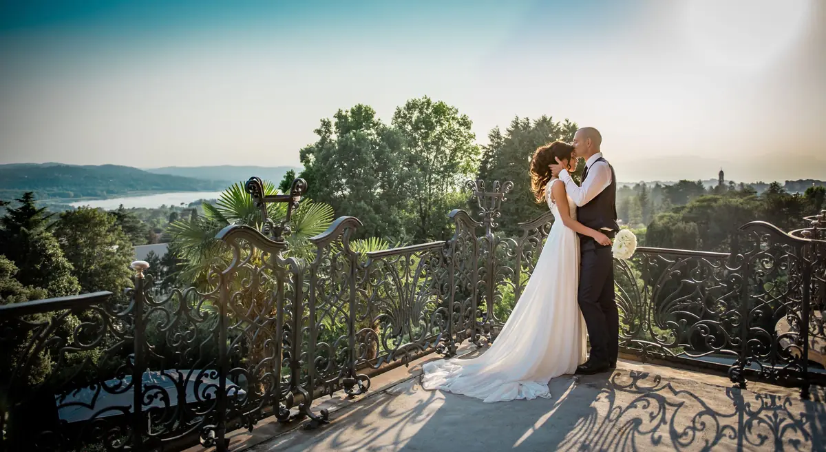 A couple on a garden terrace in northern Italy at sunset